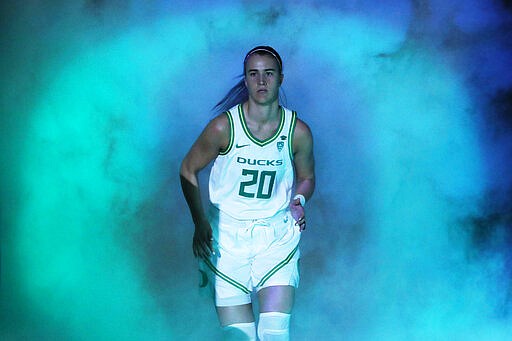 Oregon's Sabrina Ionescu (20) runs onto the court before an NCAA college basketball game against Utah in the quarterfinal round of the Pac-12 women's tournament Friday, March 6, 2020, in Las Vegas. (AP Photo/John Locher)