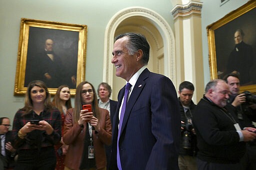 Sen. Mitt Romney, R-Utah, walks on Capitol Hill in Washington, Tuesday, Feb. 25, 2020. (AP Photo/Susan Walsh)