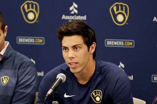 Milwaukee Brewers' Christian Yelich speaks after the Brewers announced his multi-year contract extension at the teams' spring training facility Friday, March 6, 2020, in Phoenix. (AP Photo/Matt York)