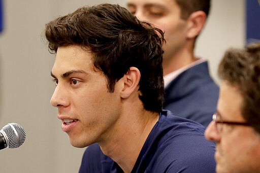 Milwaukee Brewers' Christian Yelich speaks after the Brewers announced his multi-year contract extension at the teams' spring training facility Friday, March 6, 2020, in Phoenix. (AP Photo/Matt York)