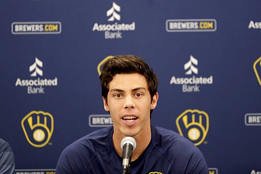 Milwaukee Brewers' Christian Yelich speaks after the Brewers announced his multi-year contract extension at the teams' spring training facility Friday, March 6, 2020, in Phoenix. (AP Photo/Matt York)