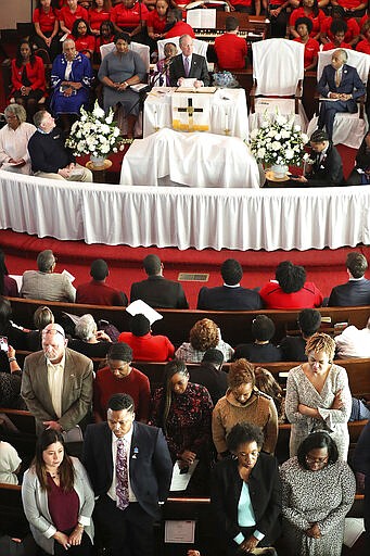 Several members in the congregation turn their backs on Democratic presidential candidate and former New York City Mayor Mike Bloomberg while he speaks at Brown Chapel African Methodist Episcopal Church, March 1, 2020, in Selma, Ala. (Curtis Compton/Atlanta Journal-Constitution via AP)