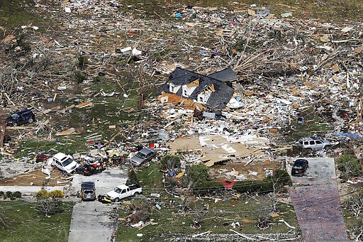 The remains of homes shattered by storms are scattered near Cookeville, Tenn., Tuesday, March 3, 2020. Tornadoes ripped across Tennessee early Tuesday, shredding more than 140 buildings and burying people in piles of rubble and wrecked basements. At least 22 people were killed. (AP Photo/Mark Humphrey)