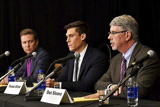 From left, Wahlberg, Woodruff, Nimmo &amp; Sloane, LLP attorneys Michael Nimmo, Parker Stinar and Dan Sloane hold a news conference regarding alleged sexual abuse claims by their clients against former University of Michigan doctor, Dr. Robert E. Anderson at the Sheraton Detroit Novi Hotel in Novi, Mich., Wednesday, March 4, 2020. (Robin Buckson/Detroit News via AP)