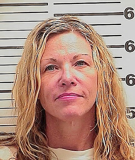 This photo released Friday, March 6, 2020 by the Madison County Sheriff's Office shows Lori Vallow, also known as Lori Daybell. The mother of two children missing for nearly six months had her bond reduced to $1 million Friday during her first court appearance on child abandonment charges in Idaho. Her two youngest children, 7-year-old Joshua "JJ" Vallow and 17-year-old Tylee Ryan, were last seen in September 2019 and police in eastern Idaho say both Lori Daybell and her new husband Chad Daybell have lied about the children's whereabouts. (Madison County Sheriff's Office via AP)