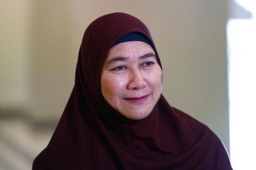 Munirah Mustafa, sister of Mastura Mustafa, who was a flight attendant on MH17, speaks to Associated Press in Kuala Lumpur, Malaysia, Tuesday, March 3, 2020. United by grief across oceans and continents, families who lost loved ones when Malaysia Airlines Flight 17 was shot down in 2014 hope that a trial starting next week will finally deliver them something that has remained elusive ever since: The truth. (AP Photo/Vincent Thian)