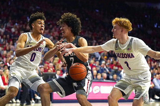 Arizona forward Josh Green (0) and Nico Mannion pressure Washington State forward CJ Elleby (2) in the first half of an NCAA college basketball game Thursday, March 5, 2020, in Tucson, Ariz. (AP Photo/Rick Scuteri)