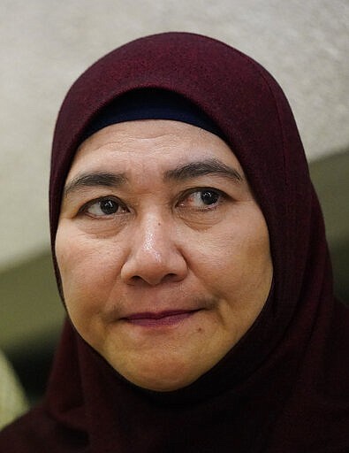 Munirah Mustafa, sister of Mastura Mustafa, who was a flight attendant on MH17, speaks to Associated Press in Kuala Lumpur, Malaysia, Tuesday, March 3, 2020. United by grief across oceans and continents, families who lost loved ones when Malaysia Airlines Flight 17 was shot down in 2014 hope that a trial starting next week will finally deliver them something that has remained elusive ever since: The truth. (AP Photo/Vincent Thian)