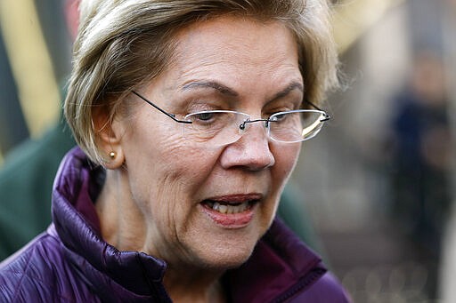 Sen. Elizabeth Warren, D-Mass., speaks to the media outside her home, Thursday, March 5, 2020, in Cambridge, Mass., after she dropped out of the Democratic presidential race. (AP Photo/Steven Senne)