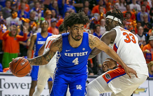 Kentucky forward Nick Richards (4) drives during the second half of an NCAA college basketball game against Florida Saturday, March 7, 2020, in Gainesville, Fla. (AP Photo/Alan Youngblood)