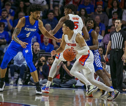 Florida guard Alex Klatsky (3) drives against Kentucky during the second half of an NCAA college basketball game Saturday, March 7, 2020, in Gainesville, Fla. (AP Photo/Alan Youngblood)