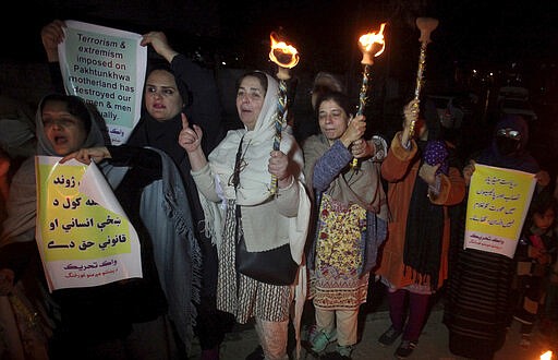 Members of a civil society take part in a pro-women demonstration ahead of Women's Day in Peshawar, Pakistan, Saturday, March 7, 2020. Pakistani women plan to hold rallies across the country to celebrate International Women's Day to bring attention to their efforts to seek better jobs, protections in the work place and end domestic violence. (AP Photo/Mohammad Sajjad)