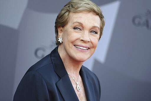 FILE - In this Sept. 29, 2015, file photo, actress Julie Andrews arrives at the Los Angeles Philharmonic 2015/2016 season opening gala at Walt Disney Concert Hall in Los Angeles. The American Film Institute says it is postponing its 48th annual AFI Life Achievement Award Gala Tribute honoring Andrews. The organization originally planned to give Andrews its Life Achievement Award on April 25, 2020, in Los Angeles. It will be rescheduled for early summer. (Photo by Richard Shotwell/Invision/AP, File)