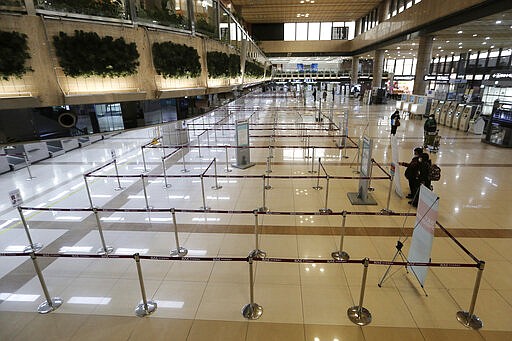 Check-in counters of Japanese airlines are deserted at Gimpo Airport in Seoul, South Korea, Saturday, March 7, 2020. South Korea announced it will end visa-free entry for Japanese citizens starting Monday in retaliation for a two-week quarantine imposed by Japan on all visitors from South Korea because of its surging viral outbreak. (AP Photo/Ahn Young-joon)