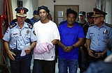 Handcuffed Ronaldinho and brother appear in Paraguayan court
