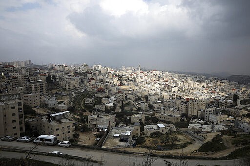 This Monday, Feb. 24 2020 photo, shows a general view of the Palestinian neighborhood of Issawiya in East Jerusalem. Nearly every day for the last nine months Israeli police have stormed into Issawiya in a campaign they say is needed to maintain law and order. Rights groups say that in addition to searching houses and issuing fines, they have detained hundreds of people &#151; some as young as 10, on suspicion of stone-throwing. The operations frequently ignite clashes, with local youths throwing rocks and firebombs, which police say justifies their heightened presence. Residents and human rights groups say the provocative raids have created an atmosphere of terror, with parents afraid to let their children play outside. (AP Photo/Mahmoud Illean)