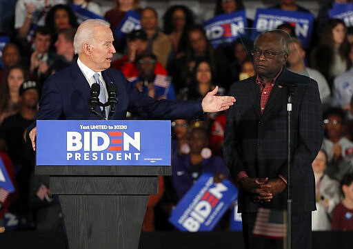 Democratic presidential candidate former Vice President Joe Biden gestures to Rep. James Clyburn, D-S.C., at a primary night election rally in Columbia, S.C., Saturday, Feb. 29, 2020 after winning the South Carolina primary. (AP Photo/Gerald Herbert)