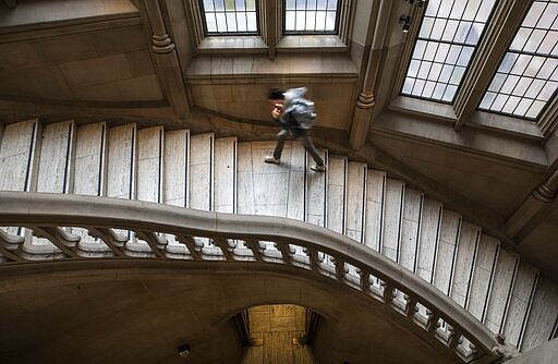 A stairway at the University of Washington's Suzzallo library Friday, March 6, 2020., after in-person classes were soon to be cancelled due to coronavirus concerns. (Steve Ringman/The Seattle Times via AP)