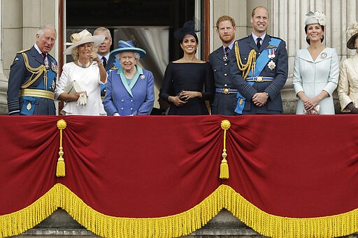 FILE - In this Tuesday, July 10, 2018 file photo, members of the royal family gather on the balcony of Buckingham Palace, with from left, Prince Charles, Camilla the Duchess of Cornwall, Prince Andrew, Queen Elizabeth II, Meghan the Duchess of Sussex, Prince Harry, Prince William and Kate the Duchess of Cambridge, as they watch a flypast of Royal Air Force aircraft pass over Buckingham Palace in London. Prince Harry and his wife, Meghan, are fulfilling their last royal commitment Monday March 9, 2020 when they appear at the annual Commonwealth Service at Westminster Abbey. It is the last time they will be seen at work with the entire Windsor clan before they fly off into self-imposed exile in North America. (AP Photo/Matt Dunham, File)