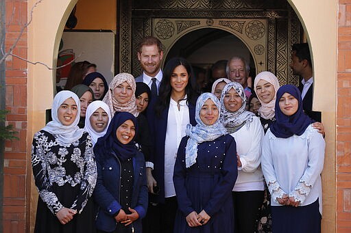 FILE - In this Sunday, Feb. 24, 2019 file photo, Britain's Prince Harry and Meghan, Duchess of Sussex pose for a photo during an Investiture for Michael McHugo the founder of 'Education for All' with the Most Excellent Order of the British Empire, in Asni Town in Morocco. Prince Harry and his wife, Meghan, are fulfilling their last royal commitment Monday March 9, 2020 when they appear at the annual Commonwealth Service at Westminster Abbey. It is the last time they will be seen at work with the entire Windsor clan before they fly off into self-imposed exile in North America. (AP Photo/Kirsty Wigglesworth, file)