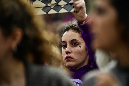 Women take part in a protest on International Women's Day in Pamplona, northern Spain, Sunday, March 8, 2020. Spanish women are marking International Women's Day with a full day strike and dozens of protests across the country against the wage gap and gender violence. (Alvaro Barrientos)