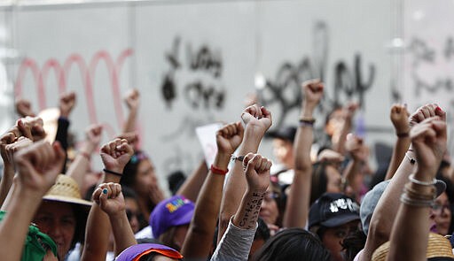 Women march during International Women's Day in Mexico City, Sunday, March 8, 2020. Protests against gender violence in Mexico have intensified in recent years amid an increase in killings of women and girls. (AP Photo/Eduardo Verdugo)