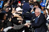 Despite virus risk, 2020 hopefuls keep up campaigns for now
