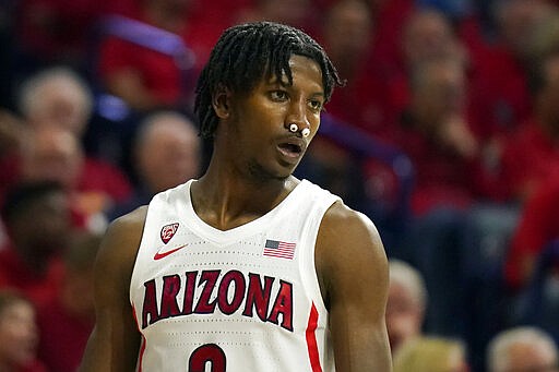 Arizona guard Dylan Smith returns to the game against Washington after having broken his nose during the first half of an NCAA college basketball game Saturday, March 7, 2020, in Tucson, Ariz. (AP Photo/Rick Scuteri)