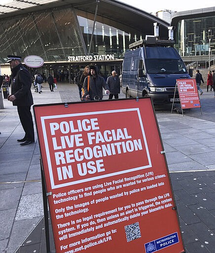 A mobile police facial recognition facility outside a shopping centre in London Tuesday Feb. 11, 2020, &#147;We don't accept this. This isn't what you do in a democracy,&quot; said Silkie Carlo, director of privacy campaign group Big Brother Watch, who are demonstrating against the surveillance.  London police started using facial recognition surveillance cameras mounted on a blue police van on Tuesday to automatically scan for wanted people, as authorities adopt the controversial technology that has raised concerns about increased surveillance and erosion of privacy. (AP Photo/Kelvin Chan)