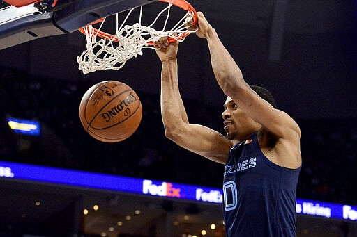 Memphis Grizzlies guard De'Anthony Melton (0) dunks the ball in the second half of an NBA basketball game against the Atlanta Hawks, Saturday, March 7, 2020, in Memphis, Tenn. (AP Photo/Brandon Dill)