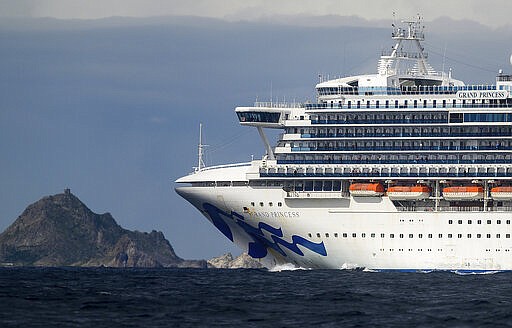 Carrying multiple people who have tested positive for COVID-19, the Grand Princess passes the Farallon Islands while holding off the coast of San Francisco, Sunday, March 8, 2020. The cruise ship is scheduled to dock at the Port of Oakland on Monday. (AP Photo/Noah Berger)