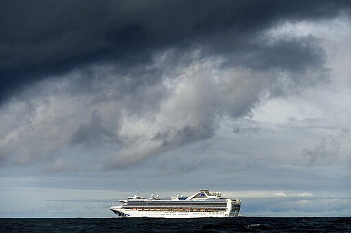 Carrying multiple people who have tested positive for COVID-19, the Grand Princess maintains a holding pattern about 30 miles off the coast of San Francisco, Sunday, March 8, 2020. The cruise ship is scheduled to dock at the Port of Oakland on Monday. (AP Photo/Noah Berger)