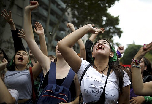 Women demonstrate at the Congress during a march to commemorate the International Women's Day in Buenos Aires, Argentina, Monday, March 9, 2020.(AP Photo/Natacha Pisarenko)