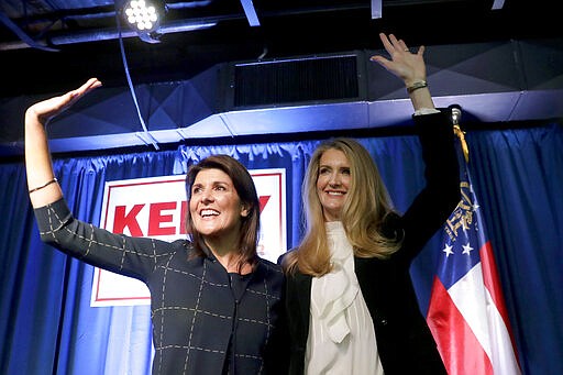 Sen. Sen. Kelly Loeffler, R-Ga., right, stands with former U.N. Ambassador Nikki Haley during a re-election campaign rally Monday, March 9, 2020, in Marietta, Ga. (AP Photo/John Bazemore)