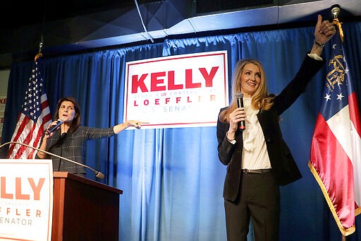 Sen. Kelly Loeffler,, R-Ga., right, speaks as former U.N. Ambassador Nikki Haley gestures during a re-election campaign rally Monday, March 9, 2020, in Marietta, Ga. (AP Photo/John Bazemore)