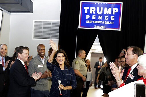 Former U.N. Ambassador Nikki Haly waves to the crowd before speaking at a re-election campaign rally for Sen. Kelly Loeffler, R-Ga. Monday, March 9, 2020, in Marietta, Ga. (AP Photo/John Bazemore)