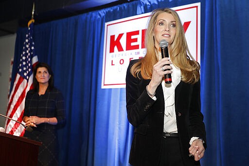 Sen. Kelly Loeffler, R-Ga., right, speaks as former U.N. Ambassador Nikki Haley looks on during a re-election campaign rally Monday, March 9, 2020, in Marietta, Ga. (AP Photo/John Bazemore)