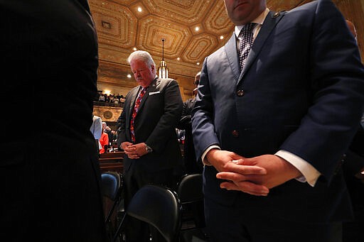 Sate Sen. Jay Luneau, D-Alexandria, prays with fellow lawmakers at the opening of the 2020 general legislative session in Baton Rouge, La., Monday, March 9, 2020. (AP Photo/Gerald Herbert)