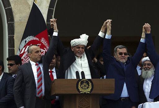 Afghan President Ashraf Ghani, center, second Vice President Sarwar Danish, right, and first Vice President Amrullah Saleh, left, at an inauguration ceremony at the presidential palace in Kabul, Afghanistan, Monday, March 9, 2020. (AP Photo/Rahmat Gul)