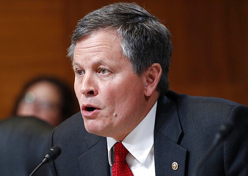 FILE - In this May 10, 2018 file photo, Sen. Steve Daines, R-Mont., asks a question of Interior Secretary Ryan Zinke during a Senate Appropriations subcommittee hearing on the FY19 budget on Capitol Hill in Washington. Montana Gov. Steve Bullock said Monday, March 9, 2020, he will run against Daines, giving Democrats a boost in their effort to take control of the Senate in November.   (AP Photo/Jacquelyn Martin, File)