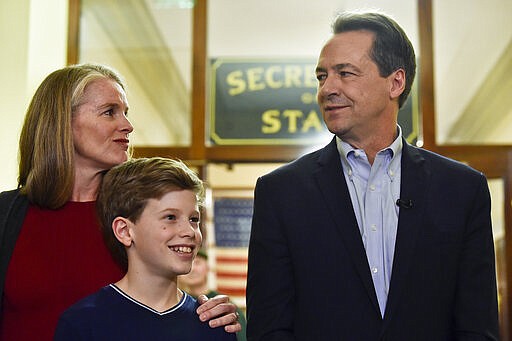 With his family by his side, Montana Gov. Steve Bullock speaks to the press after filing paperwork to run for U.S. Senate against incumbent Republican Sen. Steve Daines Monday, March 9, 2020 in Helena. (Thom Bridge/Independent Record via AP)