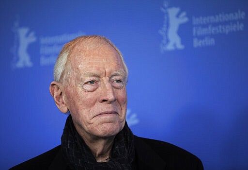 FILE - In this Feb. 10, 2012 file photo, actor Max von Sydow poses at the photo call for the film Extremely Loud and Incredibly Close during the 62 edition of International Film Festival Berlinale, in Berlin. Max von Sydow, the self-described &#147;shy boy&#148;-turned-actor who played the priest in the horror classic &#147;The Exorcist,&#148;&#160;has died, it was reported on Monday, March 9, 2020. He was 90. He was known to art house audiences through his work with Swedish director Ingmar Bergman. But it was his role as the devil-evicting priest in William Friedkin's controversial 1973 film &quot;The Exorcist&quot; that brought him to international attention.  (AP Photo/Gero Breloer, File)