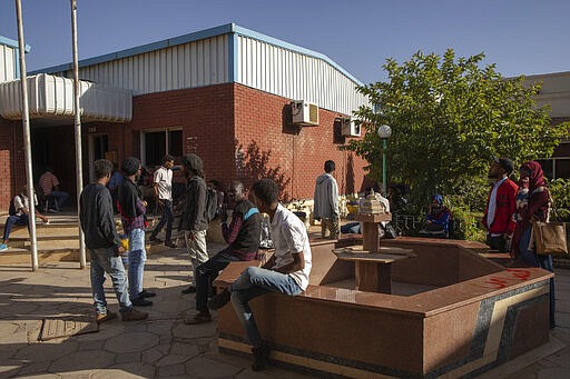 In this Jan. 11, 2020 photo, Sudanese activists wait for their turn to present their case, at the Martyrs Investigation Committee Center, in Khartoum, Sudan. The young protesters who led the uprising against former President Omar al-Bashir say they've lost trust in the generals leading the country after a brutal crackdown on their sit-in last summer by security forces that killed dozens. The generals have shown little willingness to hand over power to a civilian-led administration, one the demonstrators' key demands. (AP Photo/Nariman El-Mofty)