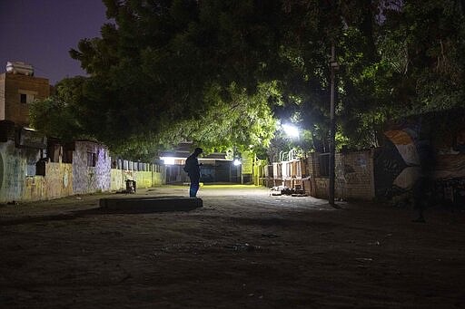 This Jan. 12, 2020 photo, shows Sudanese activist and artist Youssef al-Sewahly standing near graffiti drew during last years' revolution, in Khartoum, Sudan. When al-Sewahly took to the streets in Sudan late in 2018, he and the other protesters had one goal: to remove the autocratic regime of Omar al-Bashir and replace it with a civilian-led government. They&#146;ve achieved the former, but the latter still hangs in the balance. (AP Photo/Nariman El-Mofty)