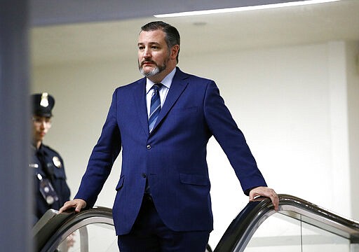 FILE - In this Jan. 29, 2020, file photo, Sen. Ted Cruz, R-Texas, rides an escalator before speaking with reporters on Capitol Hill in Washington. GOP Sen. Cruz said Sunday, March 8, 2020, he will remain at his home in Texas after learning that he shook hands and briefly chatted with a man in suburban Washington who has tested positive for coronavirus. (AP Photo/Patrick Semansky, File)