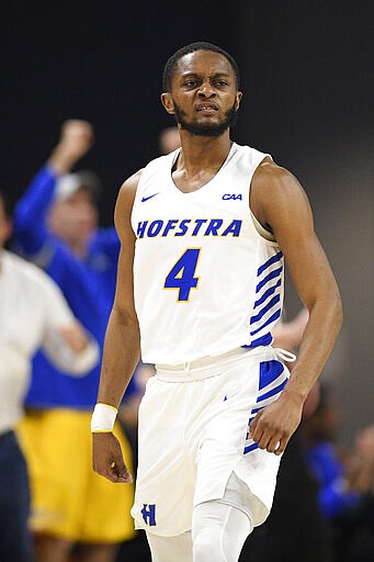 Hofstra guard Desure Buie reacts after he made a basket during the first half of the team's NCAA college basketball game against Northeastern for the championship of the Colonial Athletic Association men's tournament Tuesday, March 10, 2020, in Washington. (AP Photo/Nick Wass)