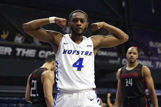 Hofstra guard Desure Buie (4) reacts after he was fouled during the second half against of an NCAA college basketball game against Northeastern in the championship of the Colonial Athletic Association men's tournament Tuesday, March 10, 2020, in Washington. Hofstra won 70-61. (AP Photo/Nick Wass)