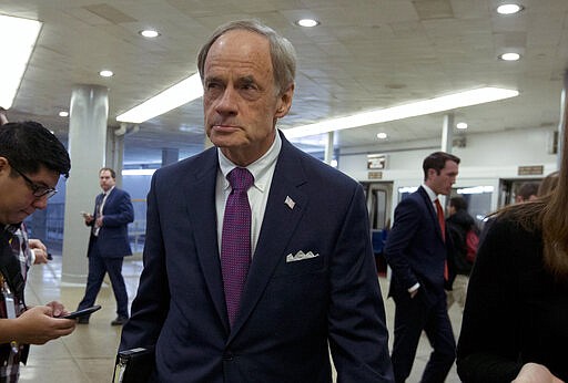 Sen. Tom Carper, D-Del., walks to the Senate chamber on Capitol Hill in Washington, Tuesday, Jan. 21, 2020. (AP Photo/Jose Luis Magana)