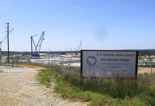 FILE - This April 9, 2012 file photo shows construction well underway for new nuclear reactors at the V.C. Summer Nuclear Station in Jenkinsville, S.C. South Carolina could pay off billions in debt and end uncertainty over lawsuits if it sells its state-owned utility, Santee Cooper, but the move would cost ratepayers more money over the next 20 years, state fiscal officials say in a report released Tuesday, Feb. 11, 2020. (AP Photo/Jeffrey Collins, File)