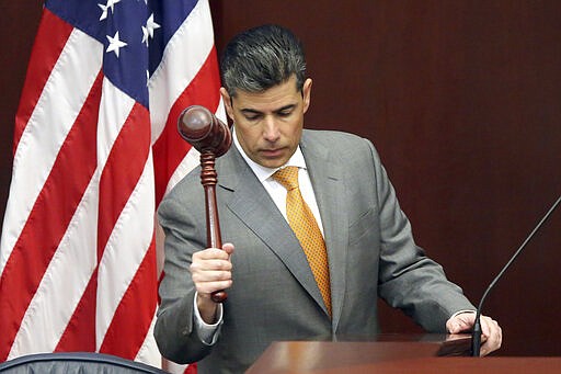 House speaker Jose Oliva, R-Miami Lakes, bangs the gavel to start session Tuesday March 10, 2020, in Tallahassee, Fla. (AP Photo/Steve Cannon)